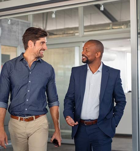 two-business-men-walking-and-talking